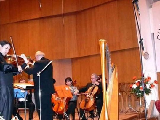 Guest violinist Vache Hoveyan performs with the AGBU Sofia C